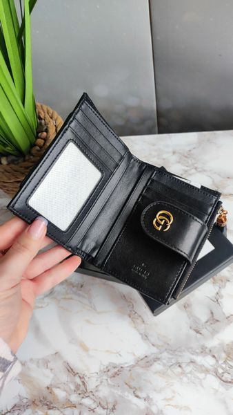 Жіночий шкіряний гаманець Gucci GG Marmont Compact Wallet чорний з золотом 896544 фото